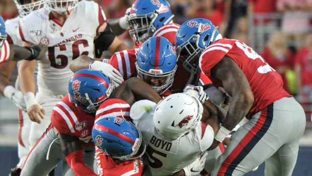 Ole Miss defenders tackle Arkansas running back Rakeem Boyd in 2019, a game that saw the Rebels emerge with a 31-17 home win.